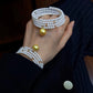 FURINA JEWELRY 18k gold NanYang gold bead freshwater AK pearl bracelet with double rings and multiple layers of natural pearls. Original design.