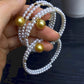 FURINA JEWELRY 18k gold NanYang gold bead freshwater AK pearl bracelet with double rings and multiple layers of natural pearls. Original design.